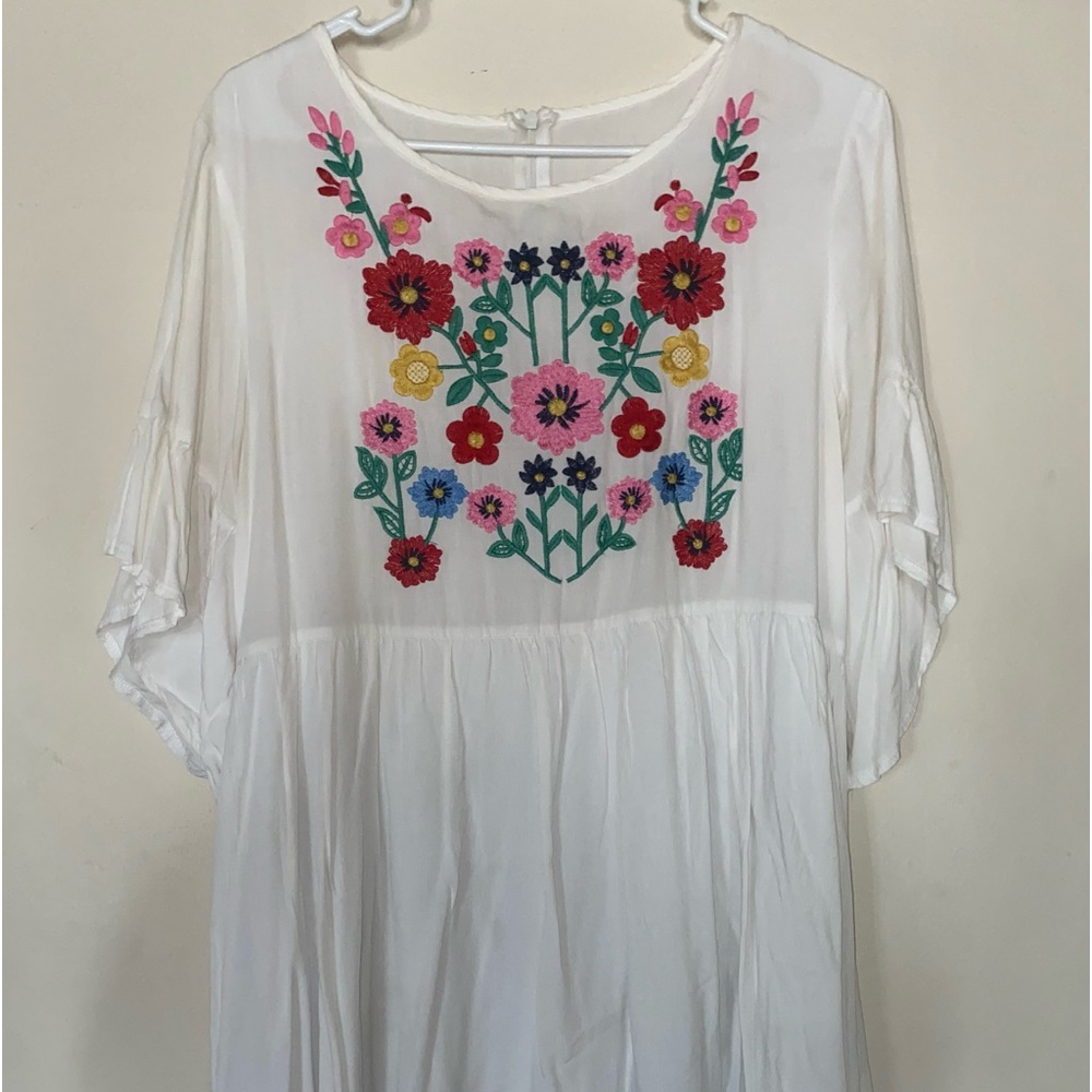 White dress with colored flowers in front